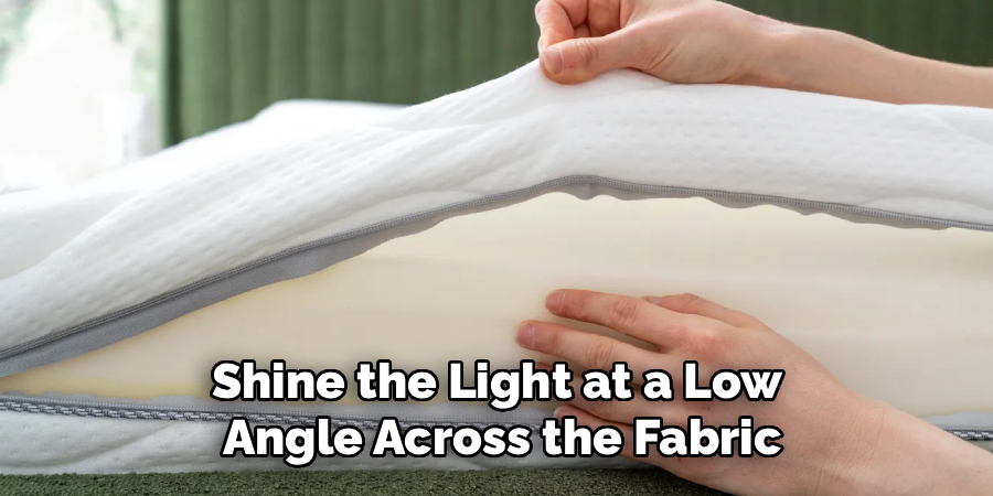 Shine the Light at a Low 
Angle Across the Fabric